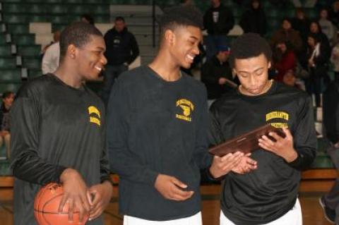 From left, Josh Lamison, Charles Manning Jr., and Tylik Furman check out the plaque commemorating their win. From left, Josh Lamison, Charles Manning Jr., and Tylik Furman check out the plaque commemorating their win.