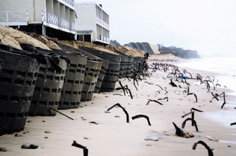 Concrete “rings” placed in front of the Royal Atlantic Resort after Hurricane Sandy and a subsequent storm and long-buried metal fence stakes were exposed by last week’s destructive northeaster. Concrete “rings” placed in front of the Royal Atlantic Resort after Hurricane Sandy and a subsequent storm and long-buried metal fence stakes were exposed by last week’s destructive northeaster.