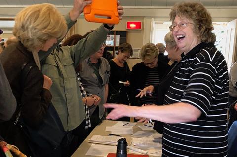 Heather Anderson, outgoing president of the Springs Historical Society and de facto director, chief cook, and bottle-washer of the Springs Library, was all smiles on Sunday as would-be members of the society lined up to join. Heather Anderson, outgoing president of the Springs Historical Society and de facto director, chief cook, and bottle-washer of the Springs Library, was all smiles on Sunday as would-be members of the society lined up to join.