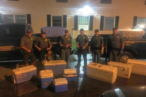 D.E.C. officers dockside in Montauk after seizing what they said were about 1,800 undersized fish left by anglers who had been aboard the Viking Starship party boat on Sept. 16. D.E.C. officers dockside in Montauk after seizing what they said were about 1,800 undersized fish left by anglers who had been aboard the Viking Starship party boat on Sept. 16.