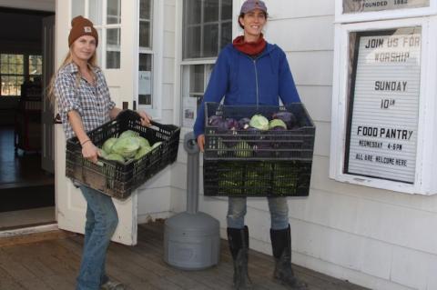 Melissa Mapes, left, and Jess Tonn of Share the Harvest Farm drop off vegetables at the Springs Food Pantry. 