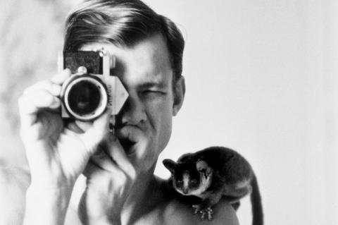 Peter Beard and a bush baby called Minor at the New Stanley Hotel in Nairobi, Keyna in 1968