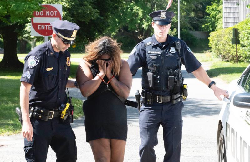 Tenia Campbell, charged with killing her twin toddlers, was led into East Hampton Town Justice Court on Friday.
